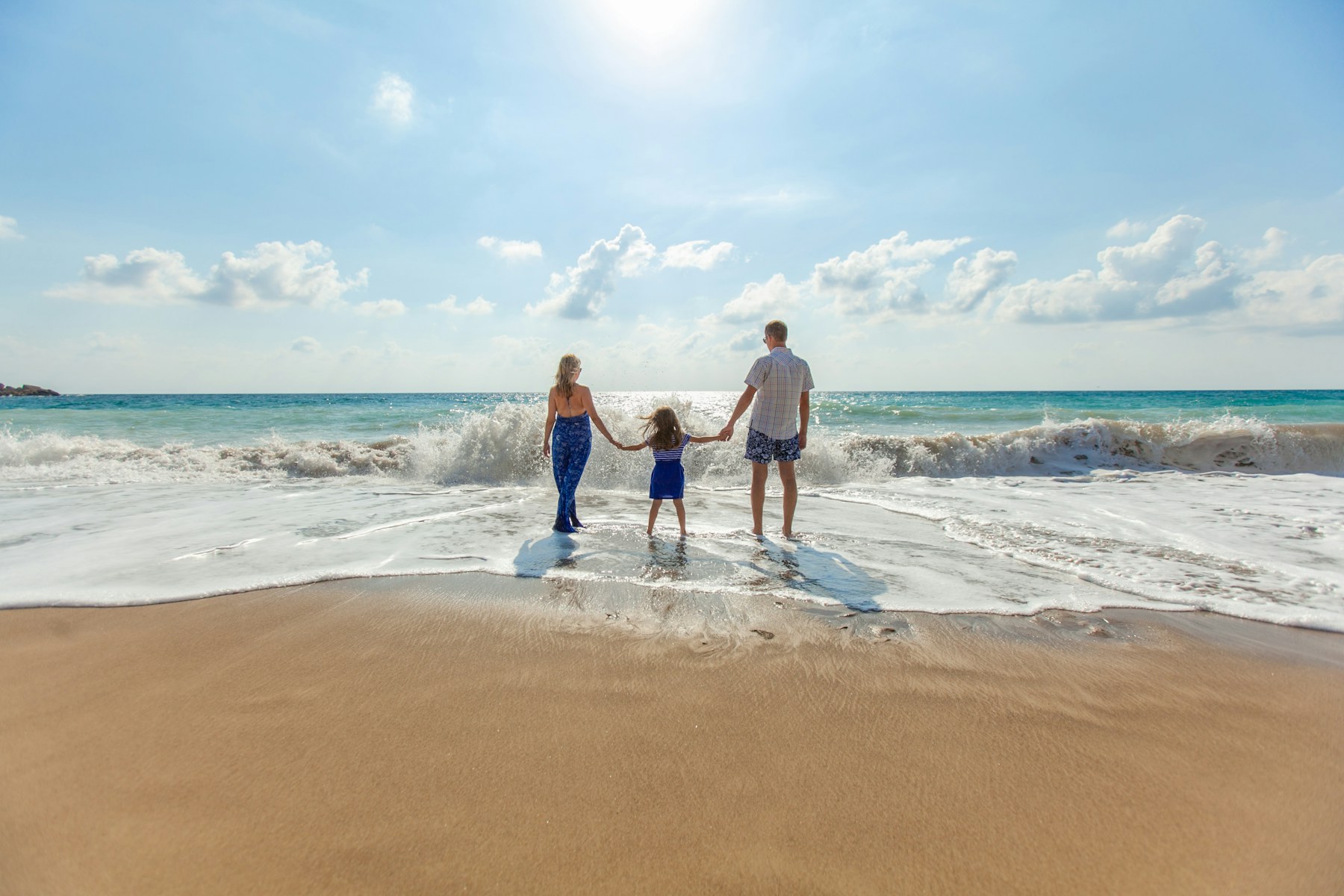 Family walking by the sea
